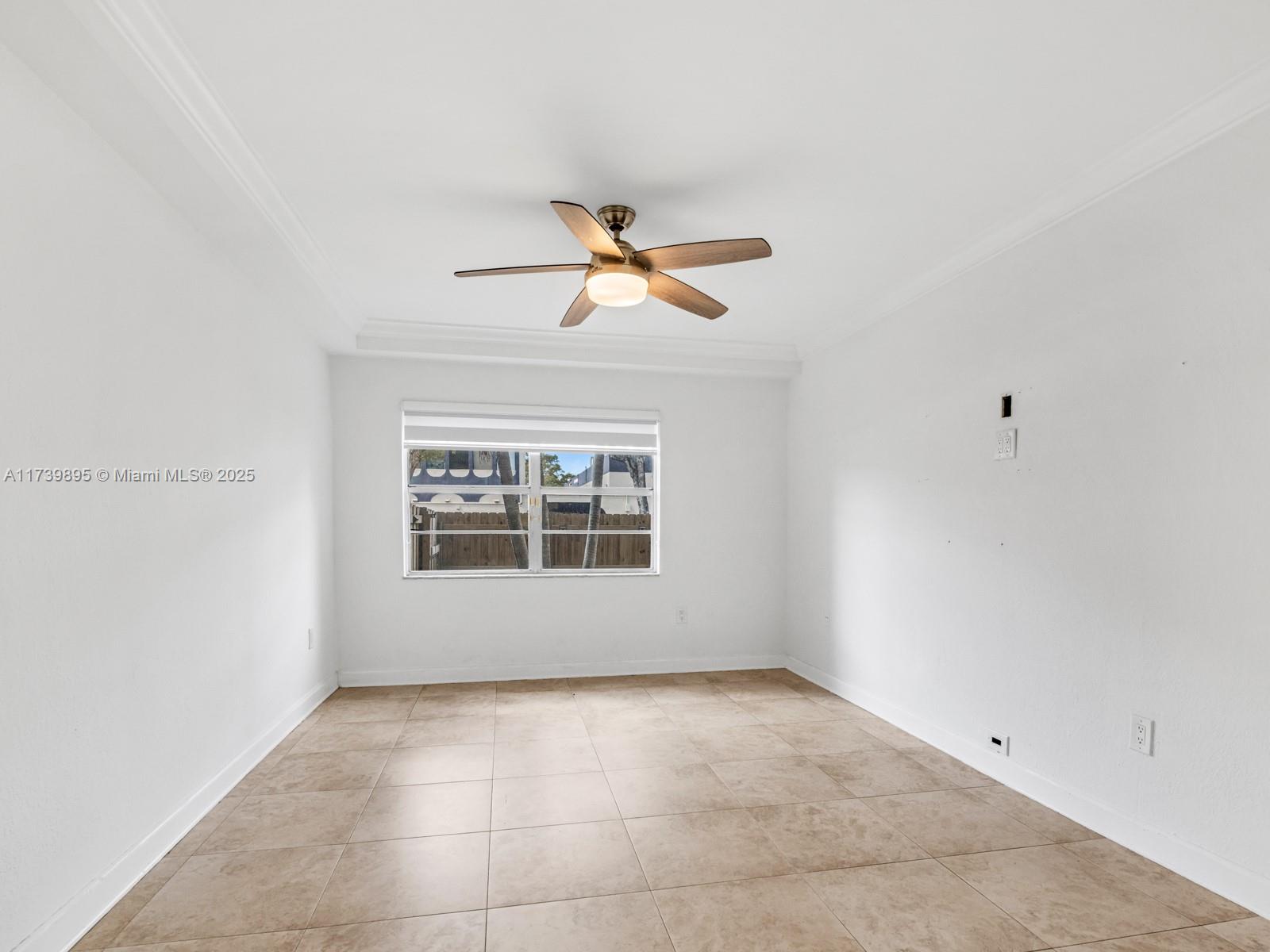 10900 Southwest 104th Street, Unit 114 Miami, FL 33176 - Photo 27 of 31 a view of an empty room with a window