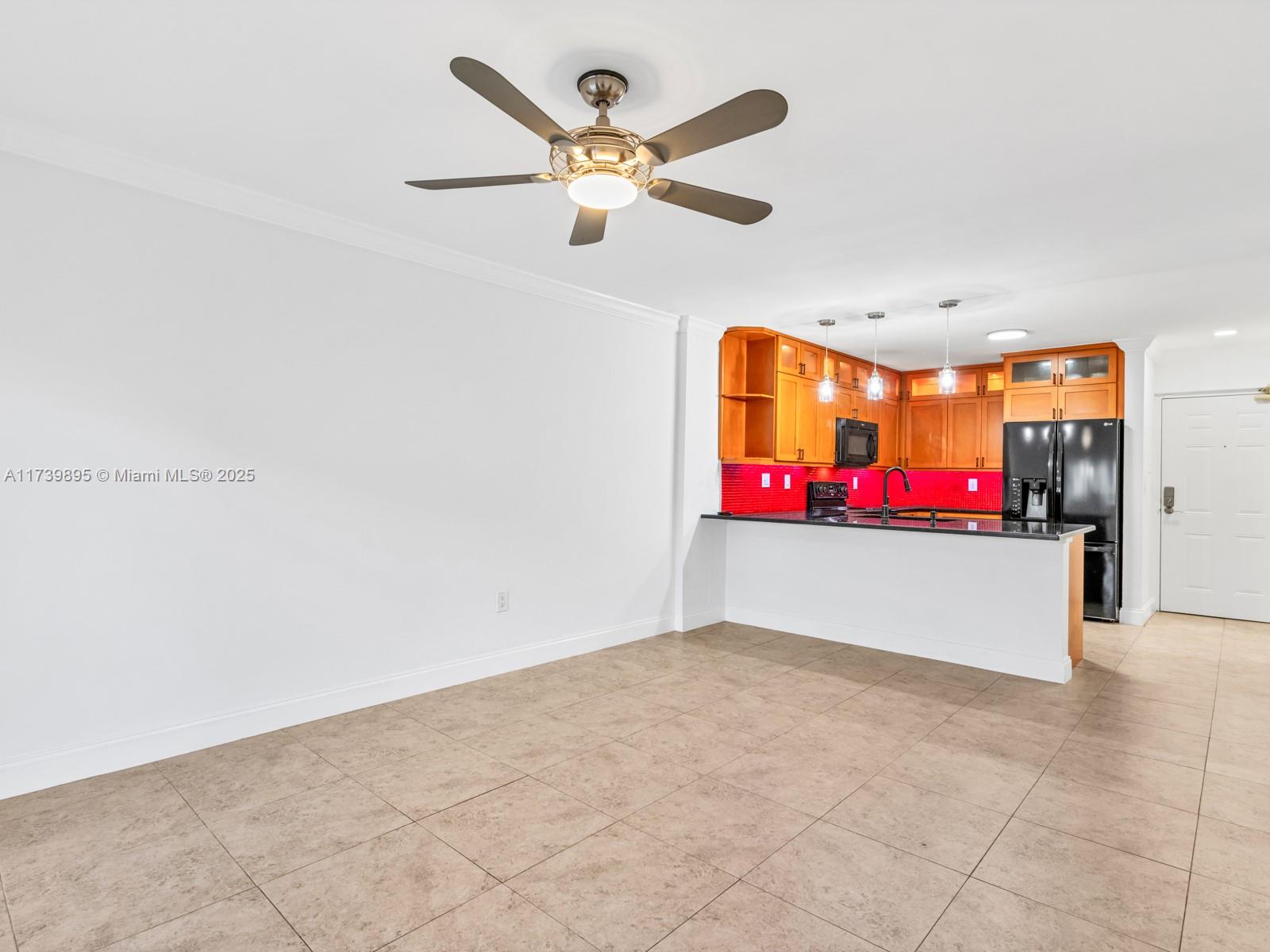 10900 Southwest 104th Street, Unit 114 Miami, FL 33176 - Photo 7 of 31 a view of an empty room with a ceiling fan
