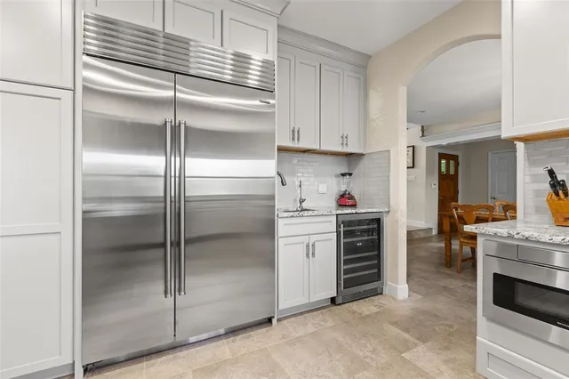 a kitchen with cabinets and a stove top oven