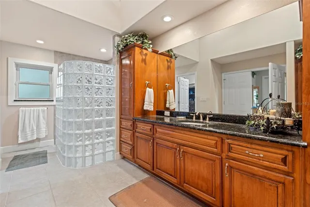a bathroom with a double vanity sink mirror and double