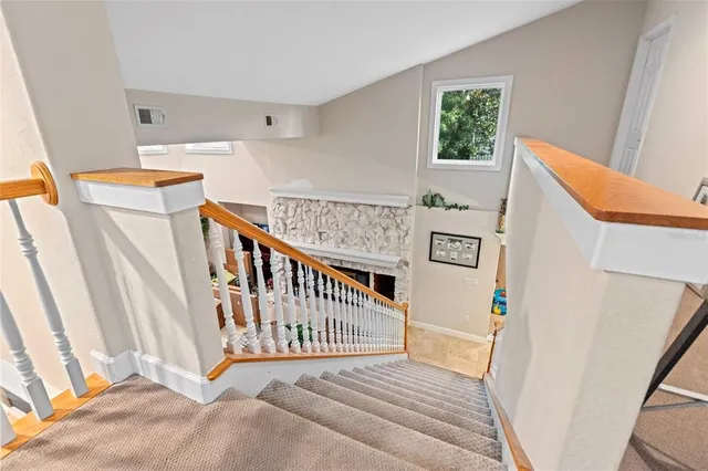 a view of a hallway with stairs