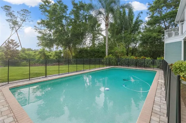 a front view of a house with swimming pool
