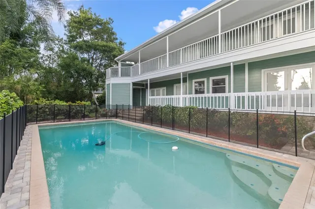 a view of a grassy field with trees