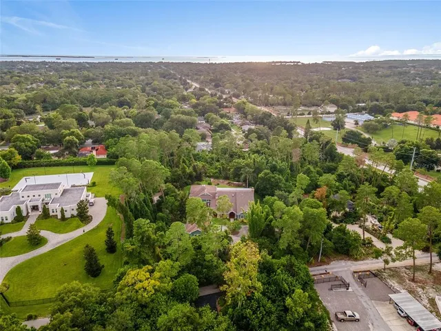 an aerial view of a houses with a yard
