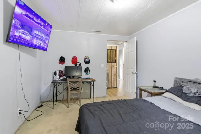 a bedroom with a bed and furniture