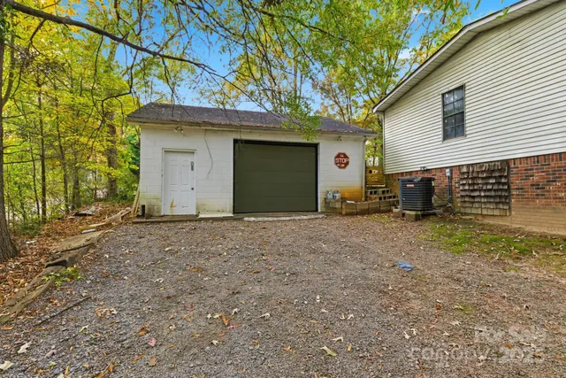 a view of a house with a yard and garage