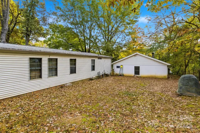 a front view of house with yard and trees