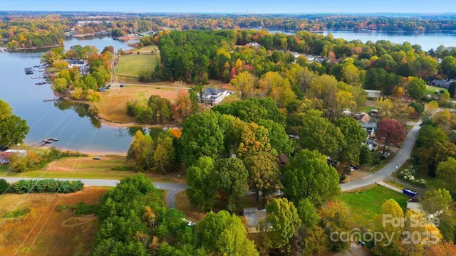 an aerial view of a houses with a yard