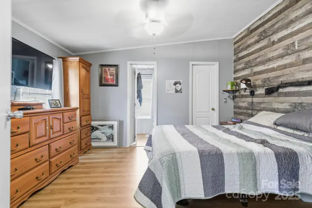 a bedroom with a bed and a dresser