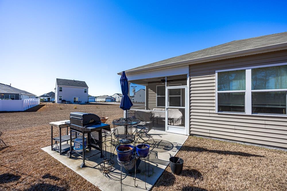 2115 Ridgedale Drive Conway, SC 29526 - Photo 25 of 38 View of patio featuring a sunroom, grilling area, and a residential view