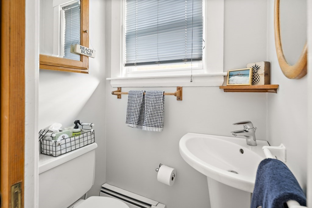 1 Bancroft Road Wellesley, MA 02481 - Photo 11 of 20 a bathroom with a sink and a mirror