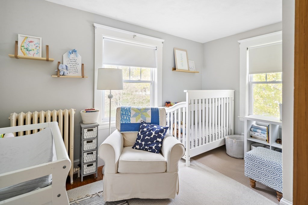 1 Bancroft Road Wellesley, MA 02481 - Photo 12 of 20 a bedroom with furniture and a window