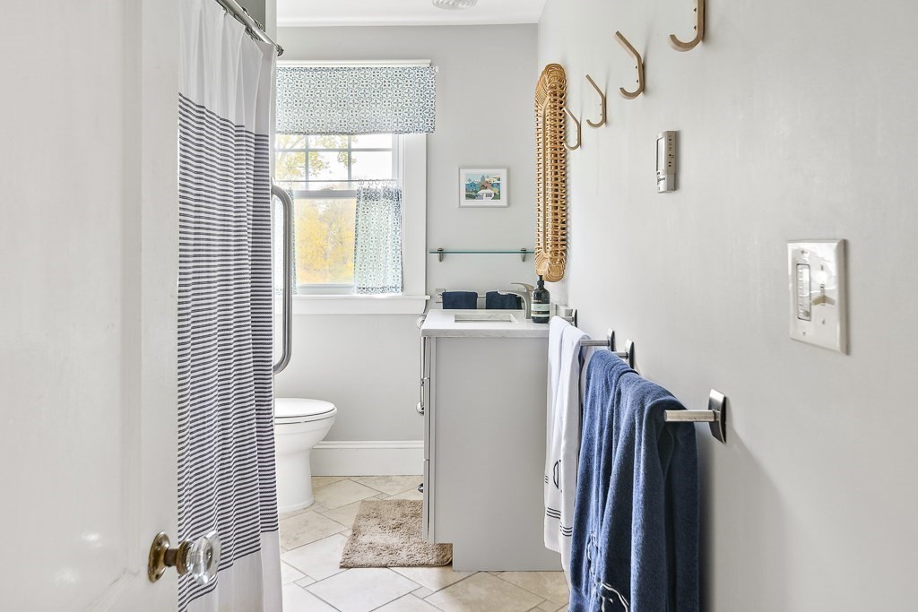 1 Bancroft Road Wellesley, MA 02481 - Photo 14 of 20 a bathroom with a sink toilet and shower