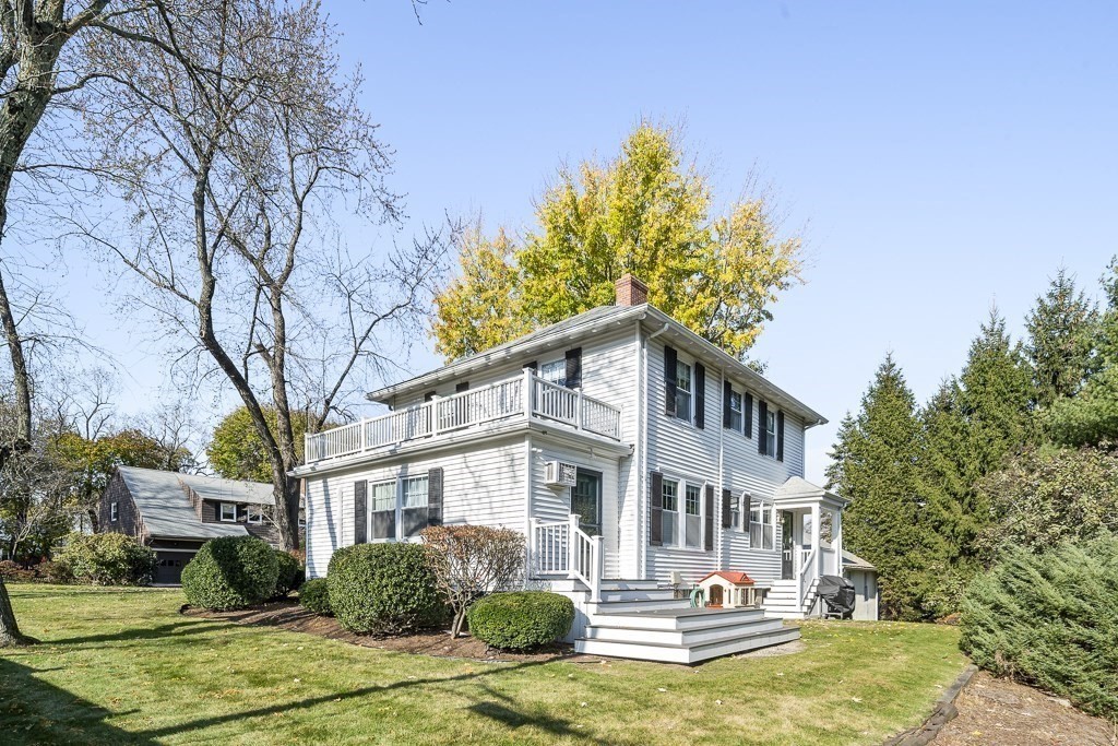 1 Bancroft Road Wellesley, MA 02481 - Photo 19 of 20 a front view of a house with a yard