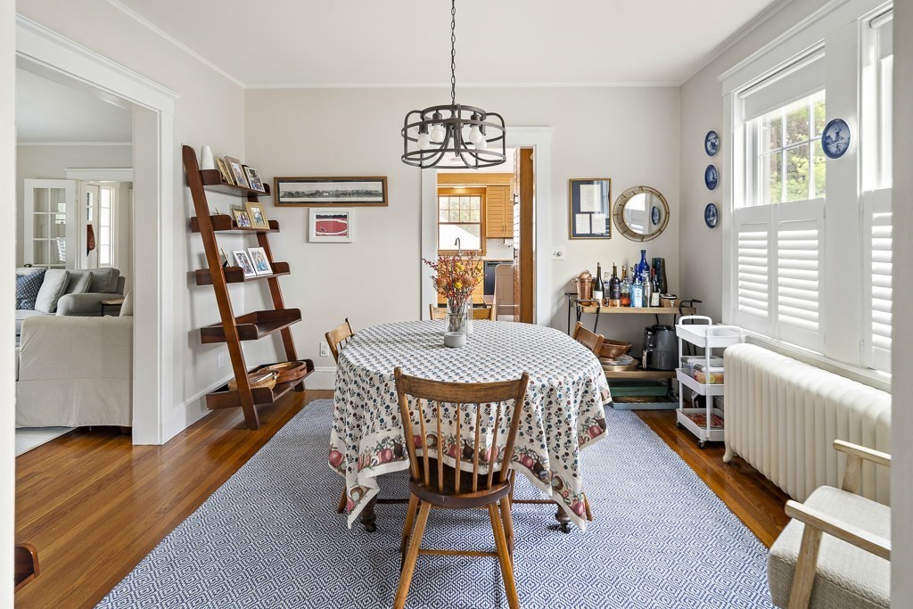 1 Bancroft Road Wellesley, MA 02481 - Photo 7 of 20 a dining room with furniture a chandelier and wooden floor