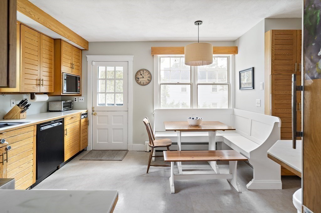 1 Bancroft Road Wellesley, MA 02481 - Photo 9 of 20 a room with furniture a window and a table