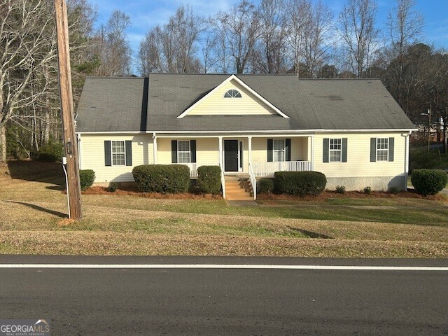 341 Baker Street Monroe, GA 30655 - Photo 1 of 10 a front view of a house with a yard