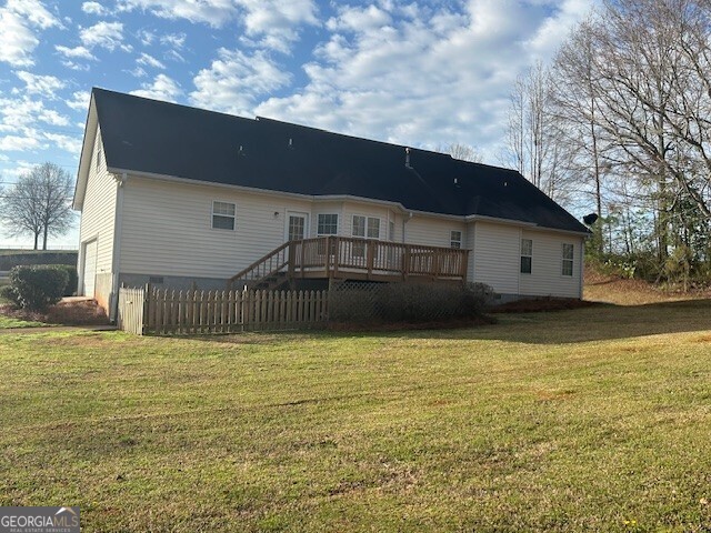 341 Baker Street Monroe, GA 30655 - Photo 3 of 10 a view of a house with a yard