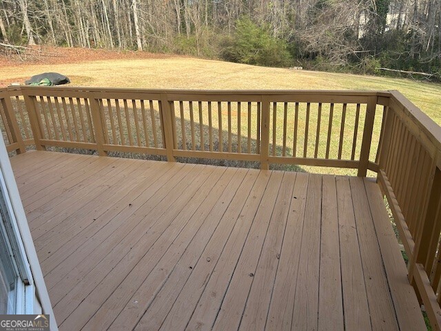 341 Baker Street Monroe, GA 30655 - Photo 4 of 10 a view of a wooden deck
