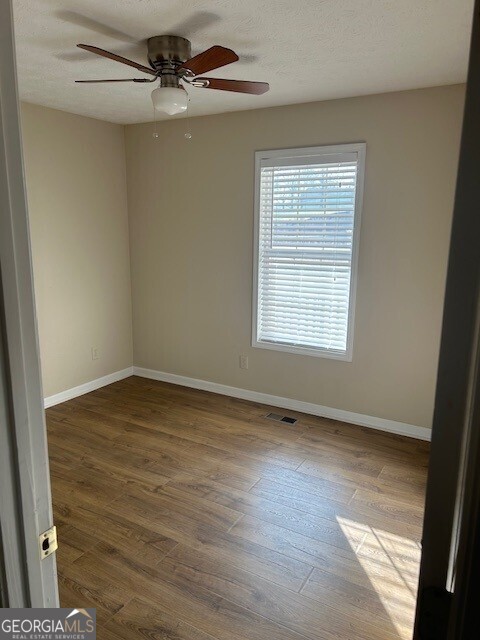 341 Baker Street Monroe, GA 30655 - Photo 10 of 10 a view of an empty room with a window