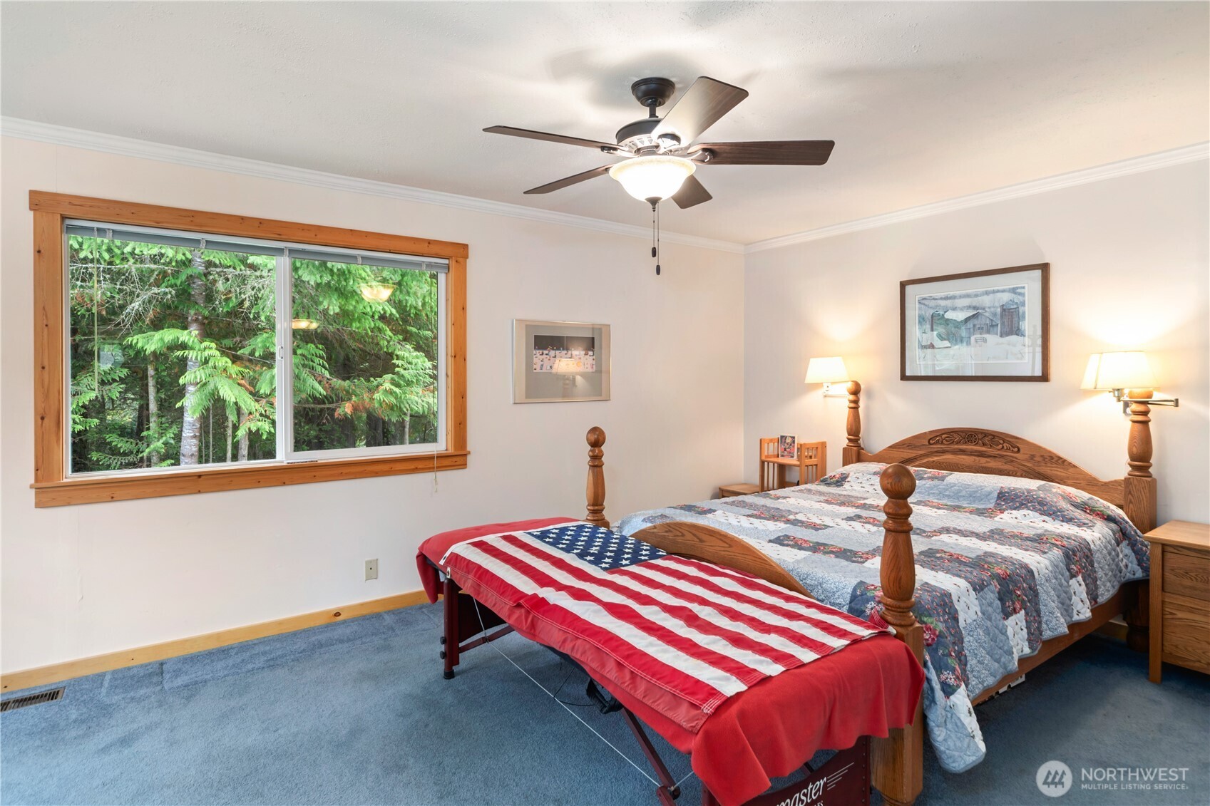 2035 Egg And I Road Chimacum, WA 98325 - Photo 12 of 40 a bedroom with a bed and a chandelier