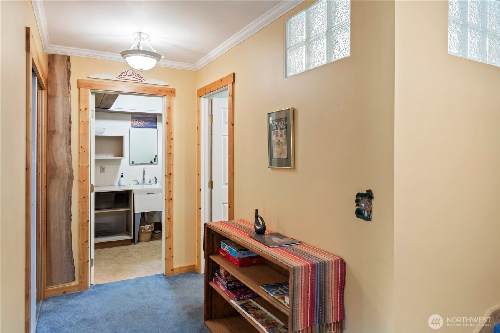 2035 Egg And I Road Chimacum, WA 98325 - Photo 19 of 40 a view of a hallway with workspace and a window