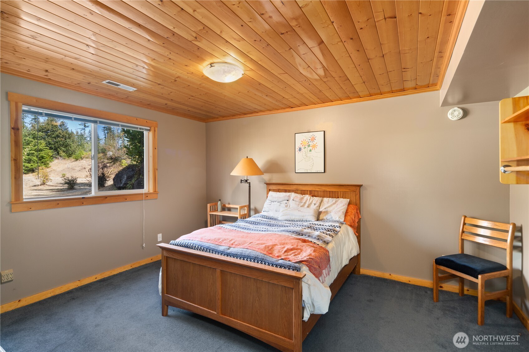 2035 Egg And I Road Chimacum, WA 98325 - Photo 21 of 40 a bed sitting in a spacious bedroom next to a window