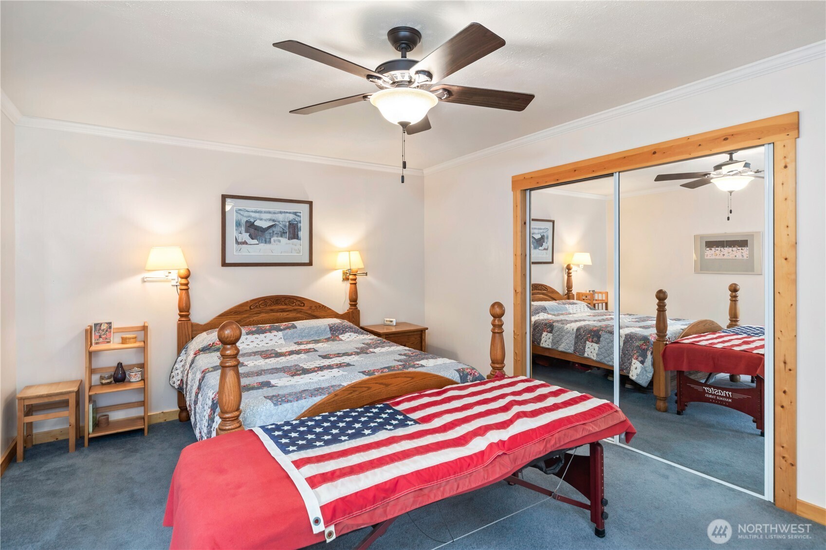 2035 Egg And I Road Chimacum, WA 98325 - Photo 10 of 40 a bedroom with a bed and a chandelier