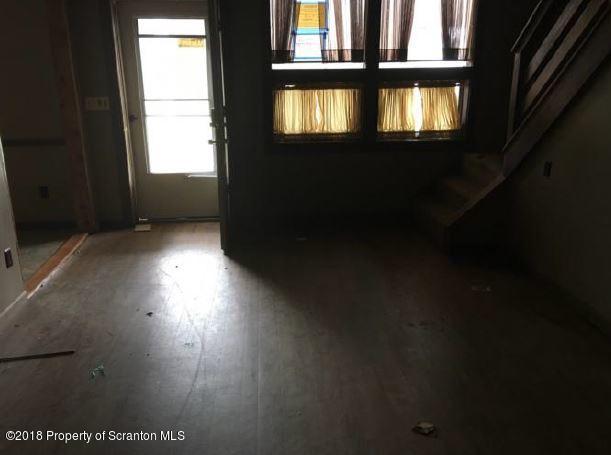 145 Tracy Brewer Road Meshoppen, PA 18630 - Photo 8 of 20 a view of an empty room and wooden floor