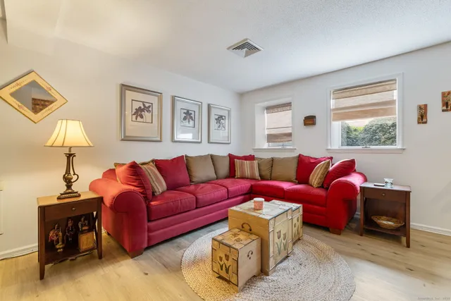 a living room with furniture and a window