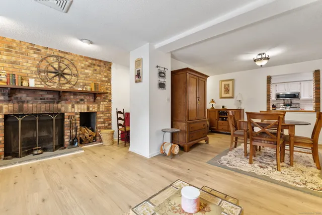 a view of a livingroom with furniture and a fireplace