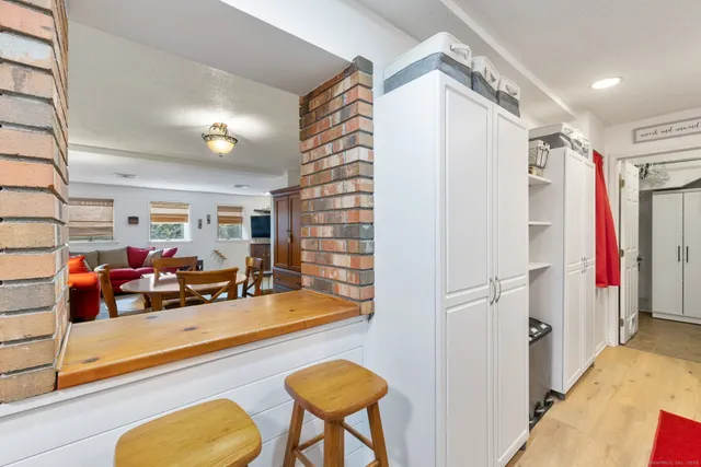 a view of a room with furniture and a rug