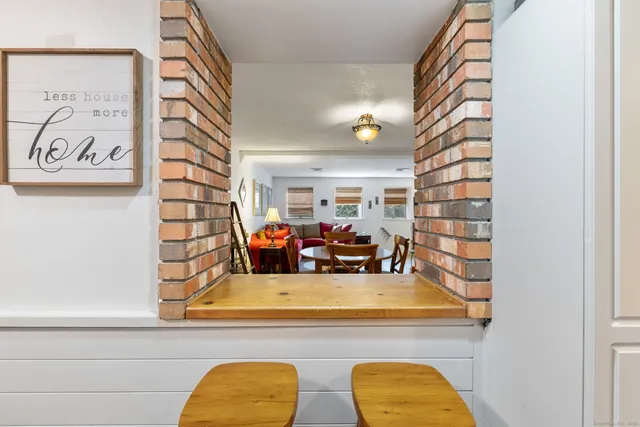a view of living room with furniture and window