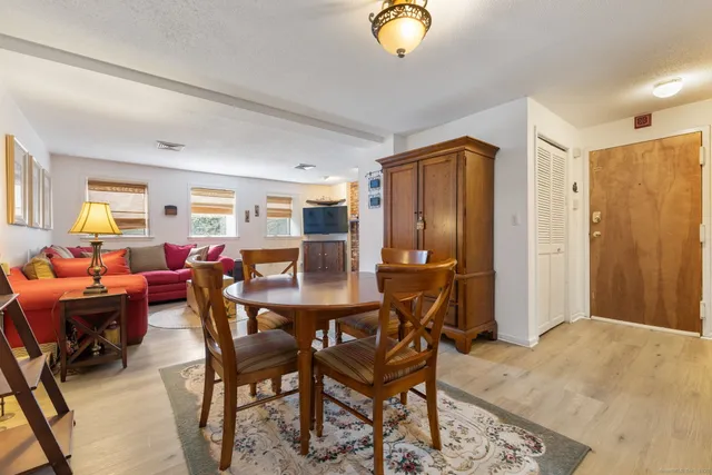 a view of a livingroom with furniture and a window