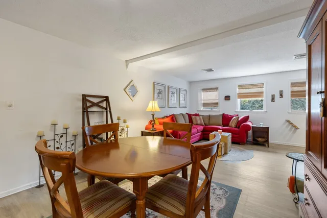 a living room with furniture and a table