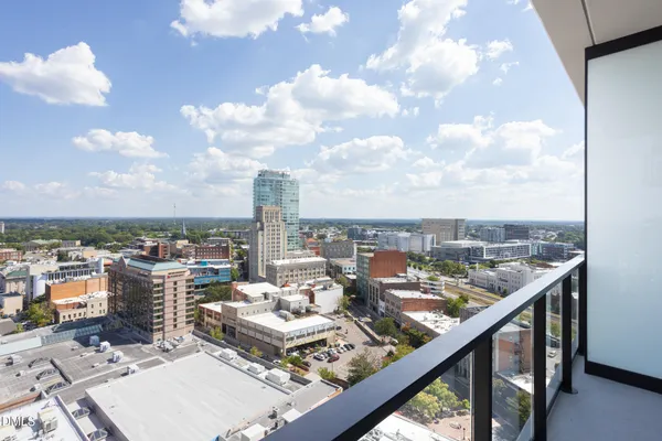 a view of a roof deck with furniture