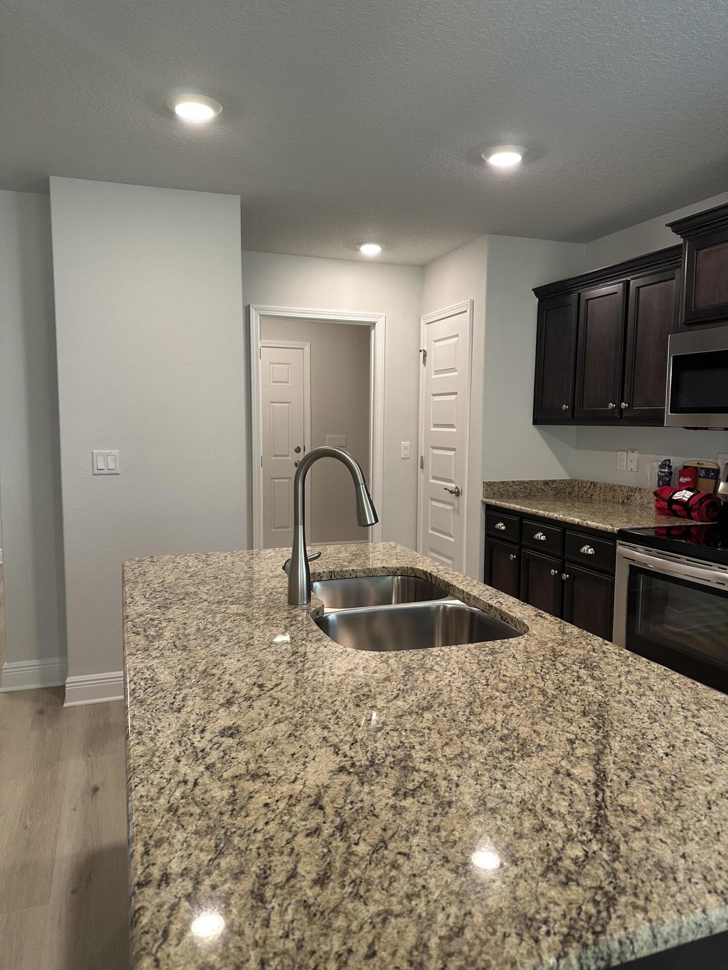 186 Ridgeway Circle Crestview, FL 32536 - Photo 13 of 23 a kitchen with granite countertop a stove and a sink
