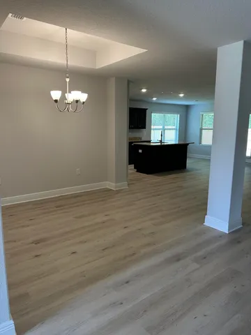 a view of a living room with wooden floor