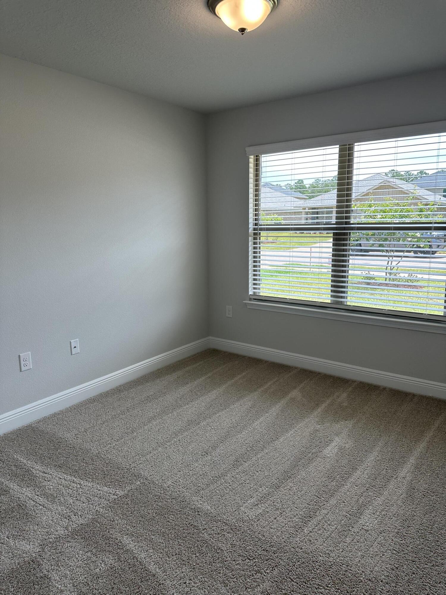 186 Ridgeway Circle Crestview, FL 32536 - Photo 9 of 23 an empty room with a window