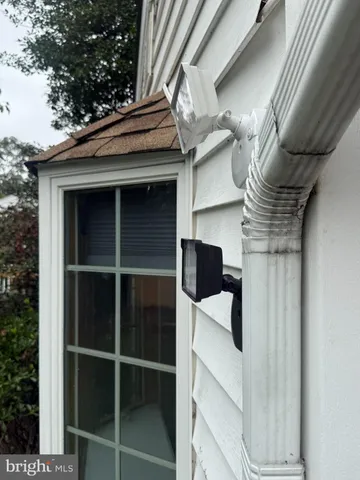a backyard of a house with barbeque oven and barbeque oven