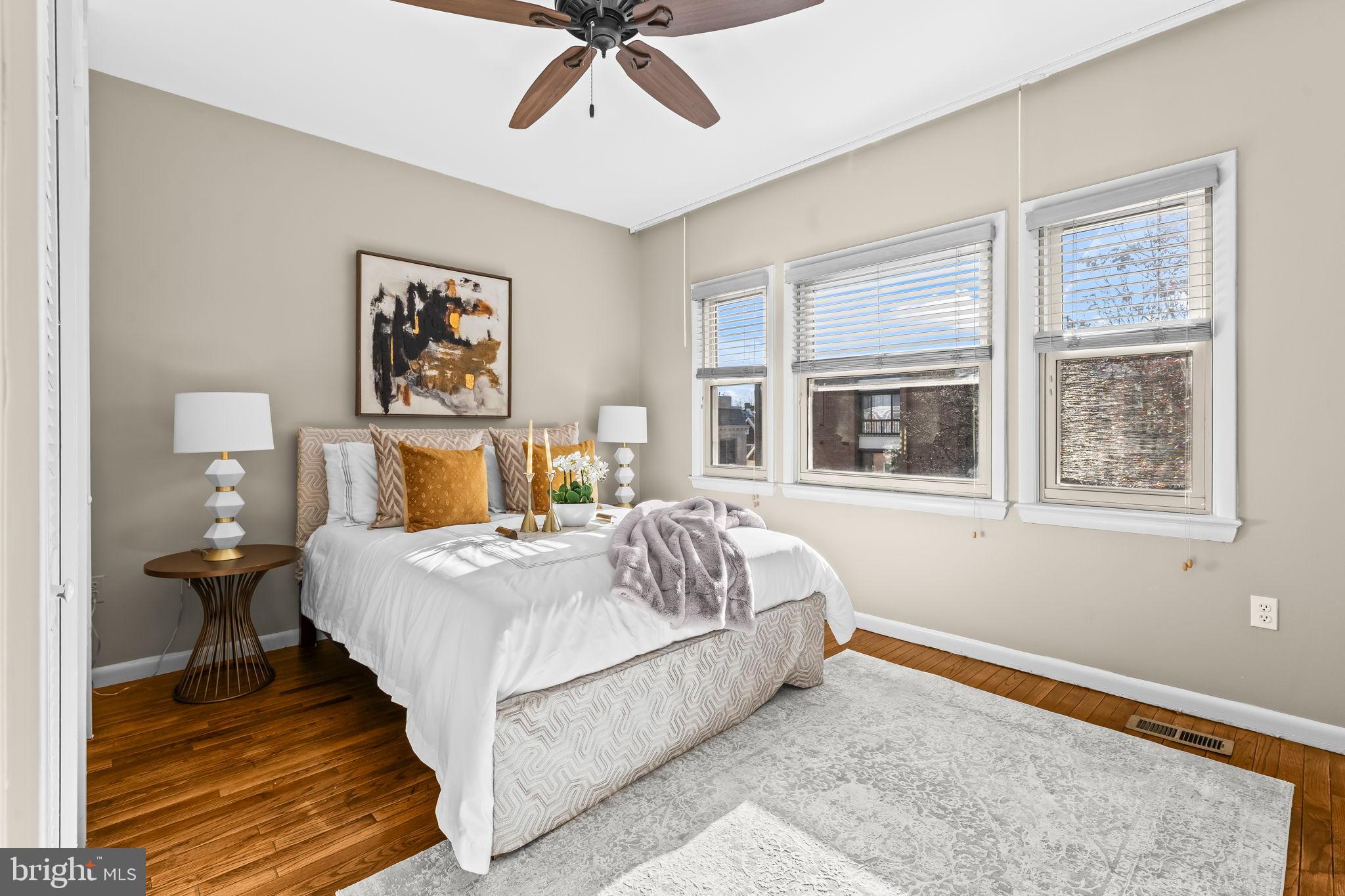 1729 Newton Street Northwest Washington, DC 20010 - Photo 17 of 45 a bedroom with a bed and a window