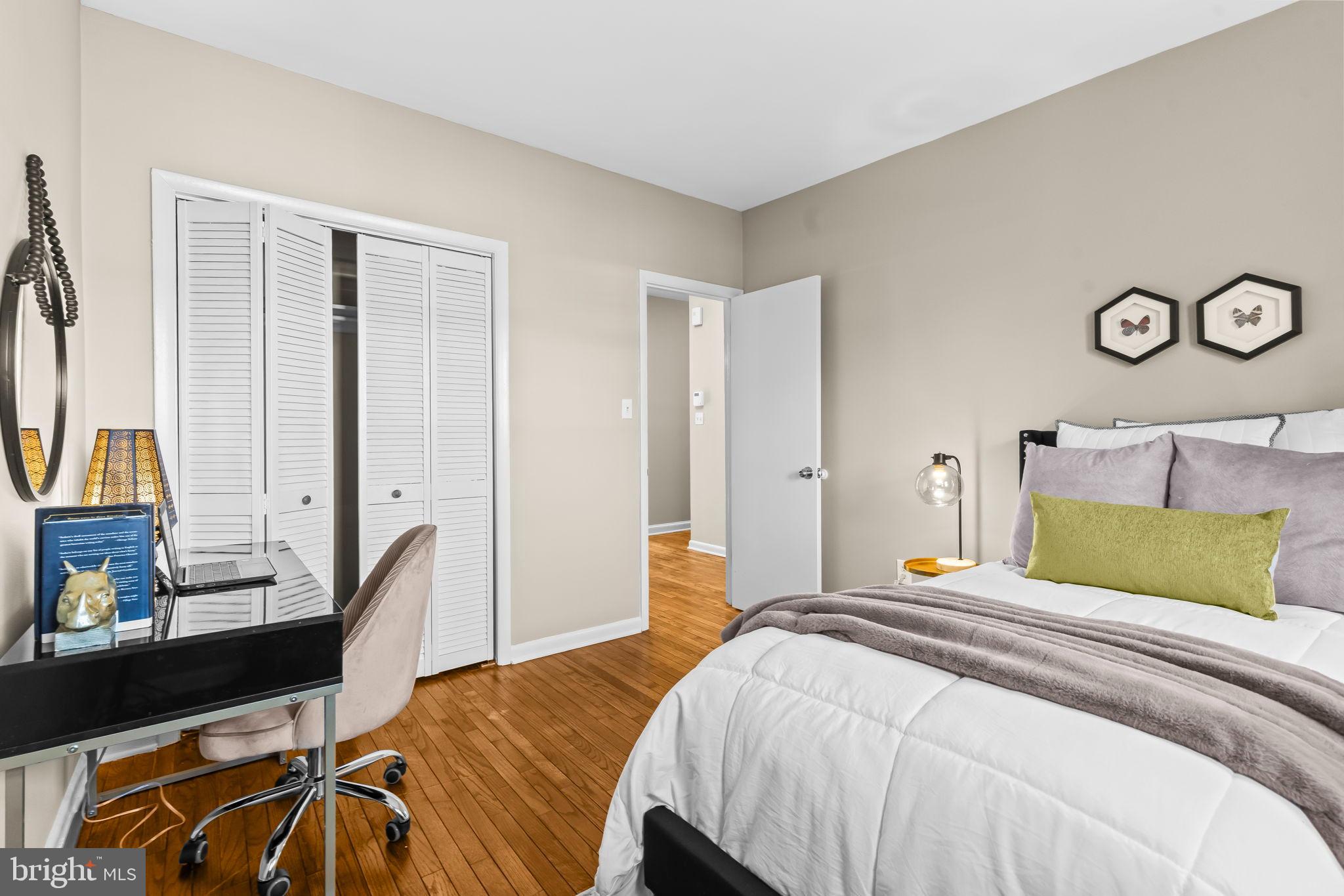 1729 Newton Street Northwest Washington, DC 20010 - Photo 27 of 45 a bedroom with a bed and a flat tv screen on dresser