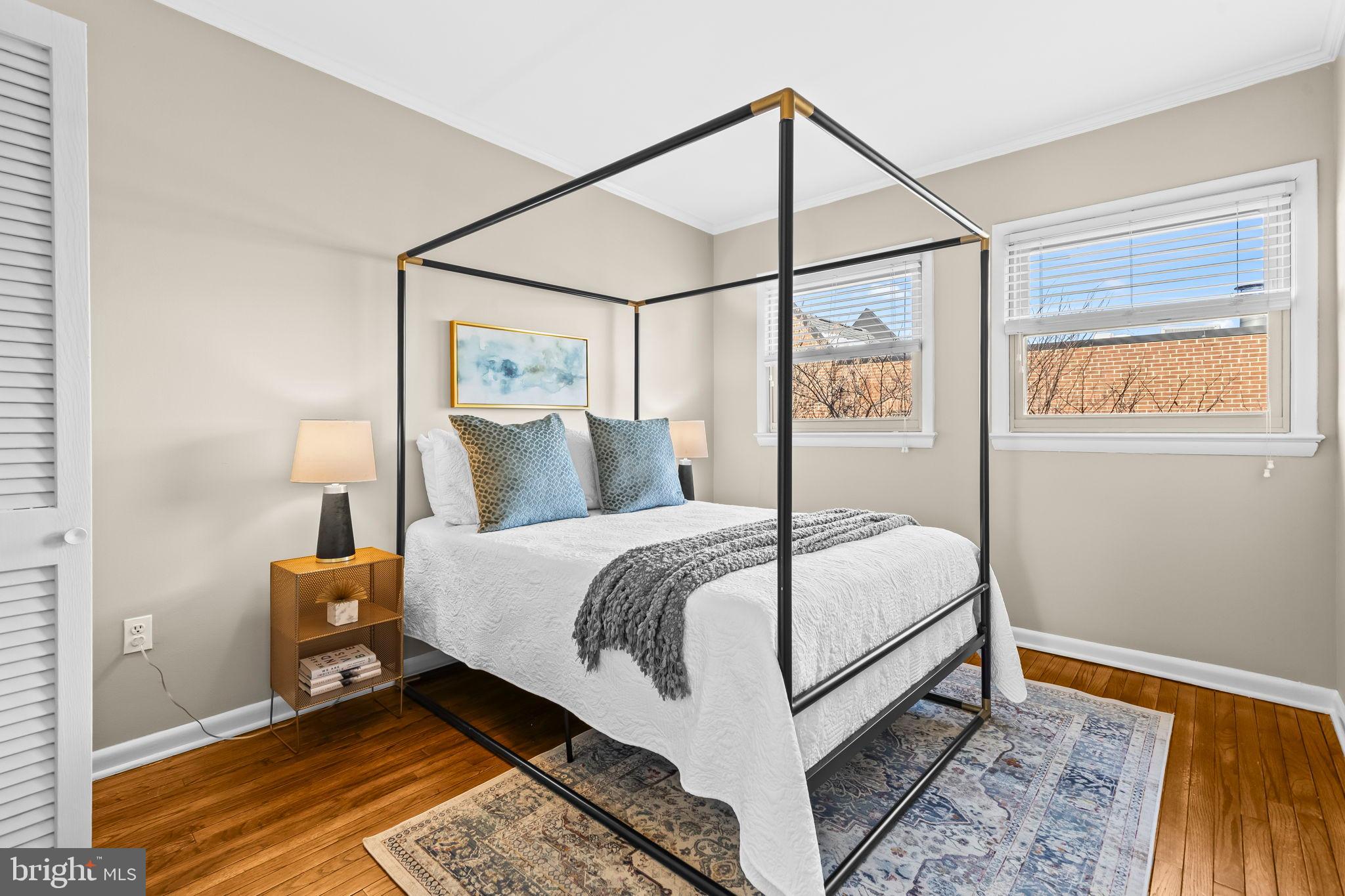 1729 Newton Street Northwest Washington, DC 20010 - Photo 28 of 45 a bedroom with a bed and a window