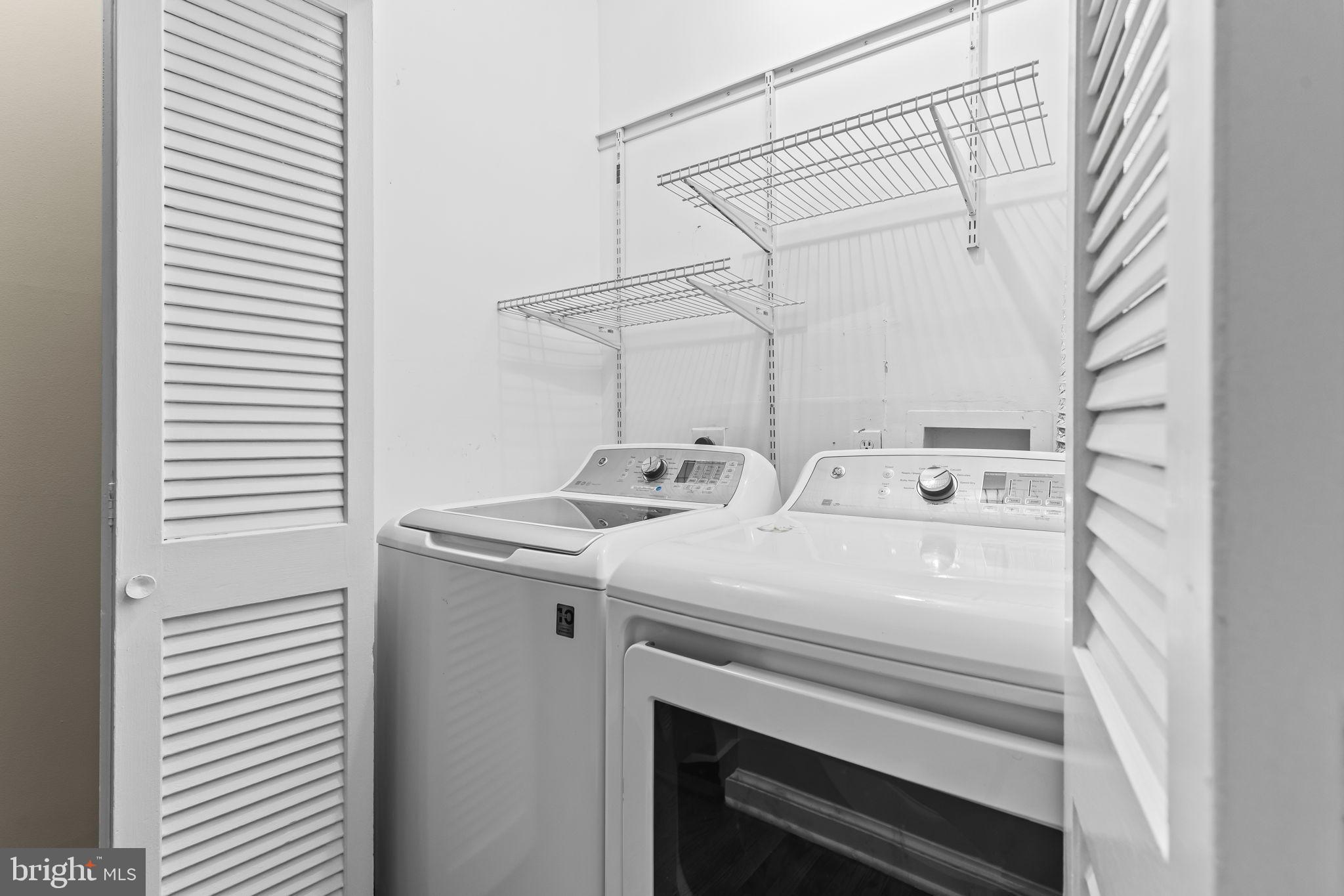1729 Newton Street Northwest Washington, DC 20010 - Photo 31 of 45 a utility room with dryer and washer