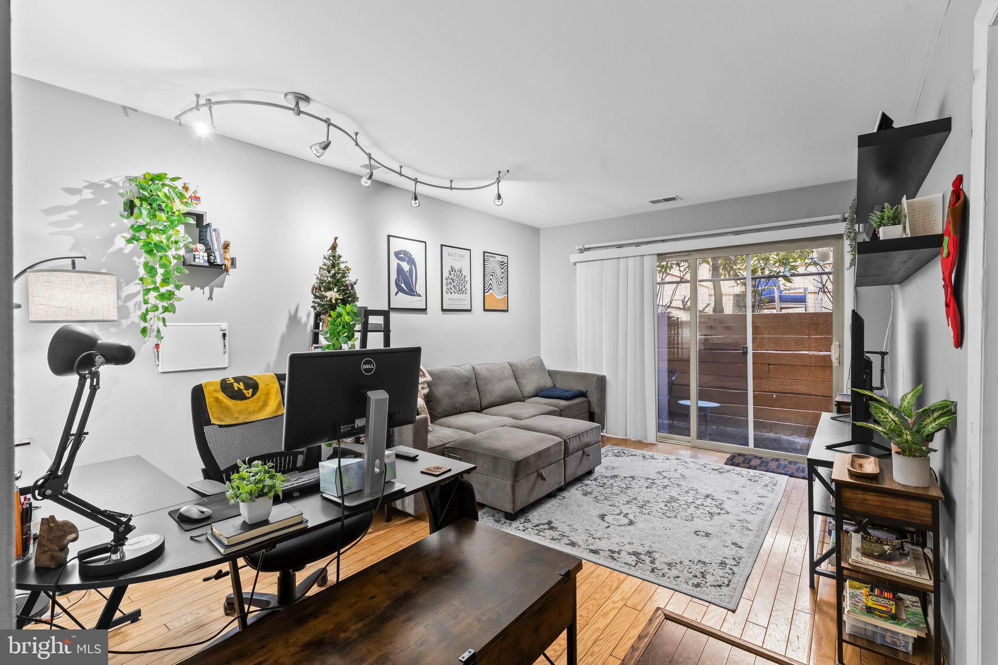 1729 Newton Street Northwest Washington, DC 20010 - Photo 37 of 45 a living room with furniture and wooden floor