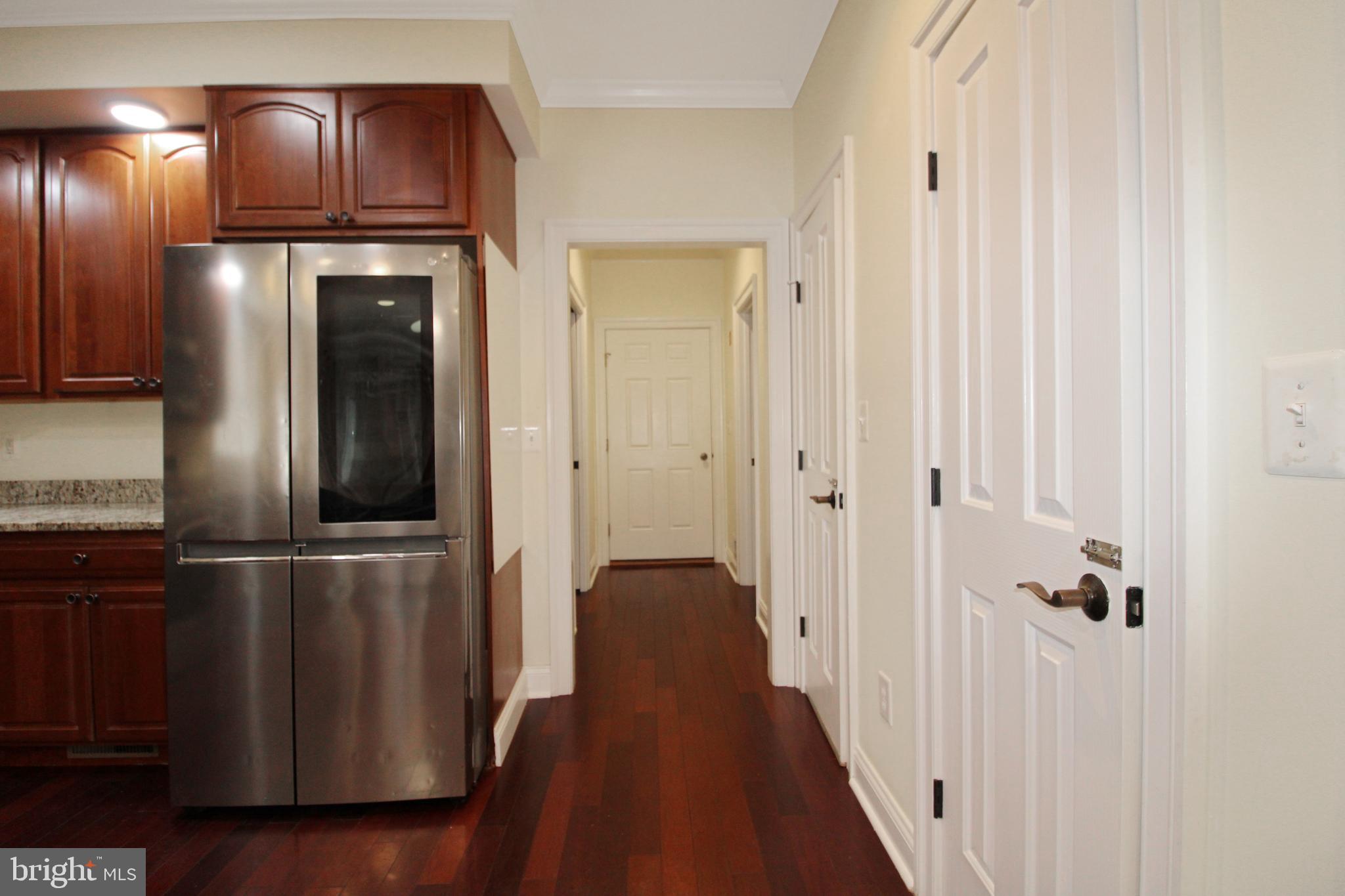 113 Paulowina Road Queen Anne, MD 21657 - Photo 15 of 42 a view of a hallway with wooden floor