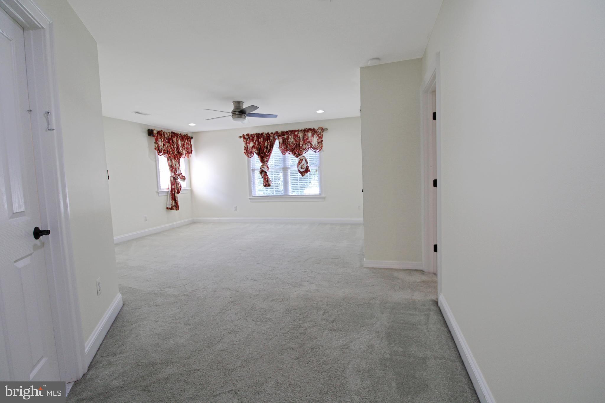 113 Paulowina Road Queen Anne, MD 21657 - Photo 21 of 42 an empty room with windows and closet