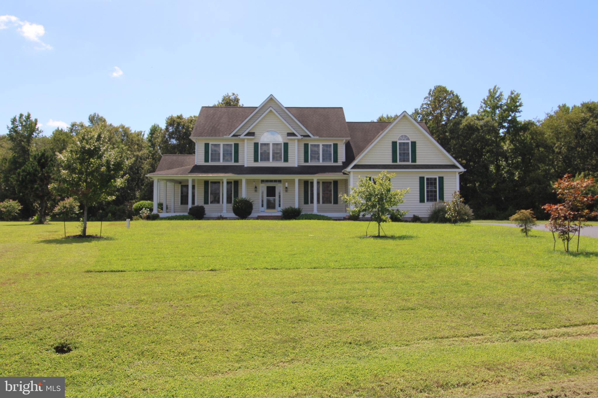 113 Paulowina Road Queen Anne, MD 21657 - Photo 35 of 42 a front view of a house with a garden