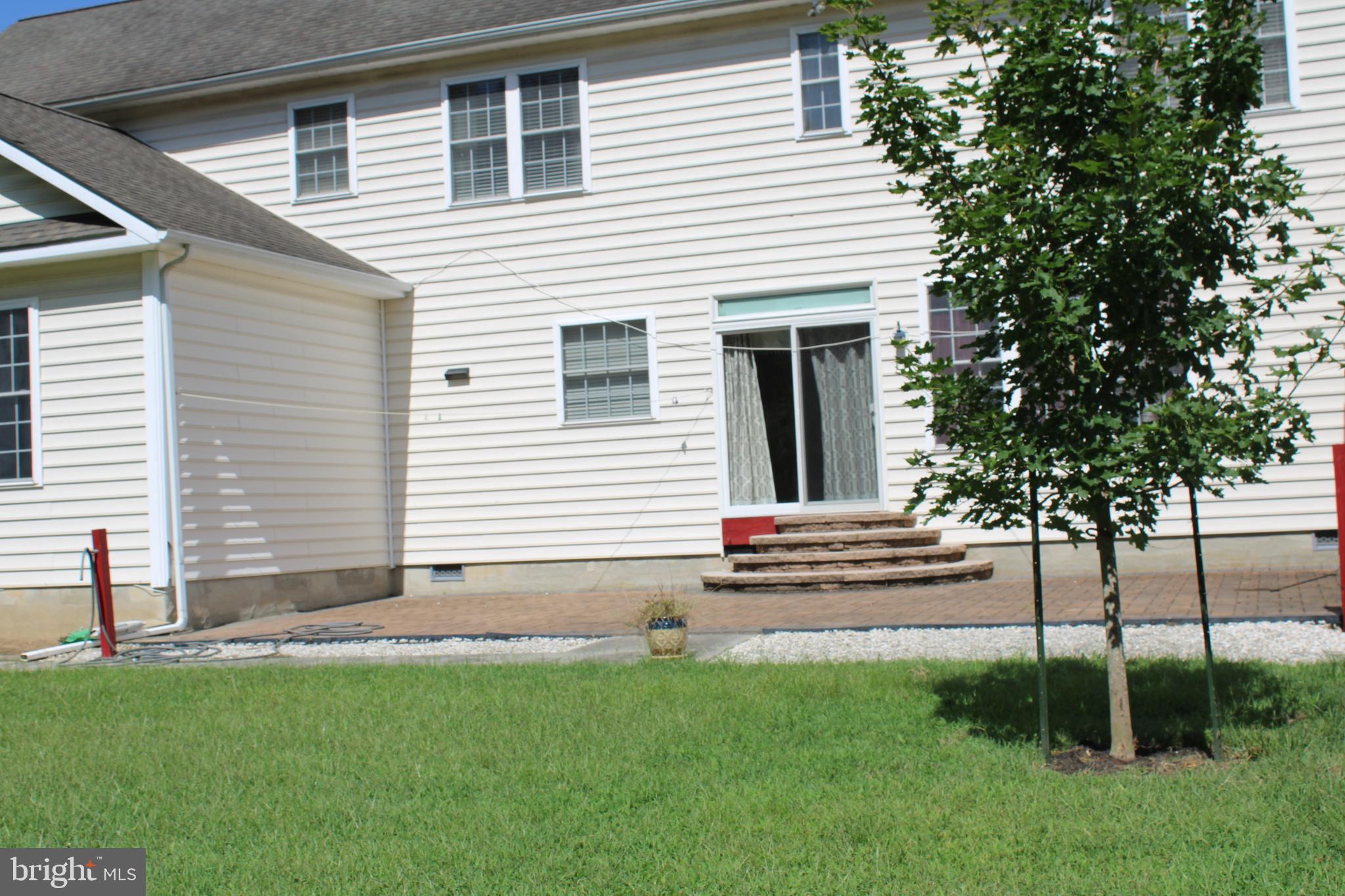 113 Paulowina Road Queen Anne, MD 21657 - Photo 40 of 42 a front view of a house with a garden