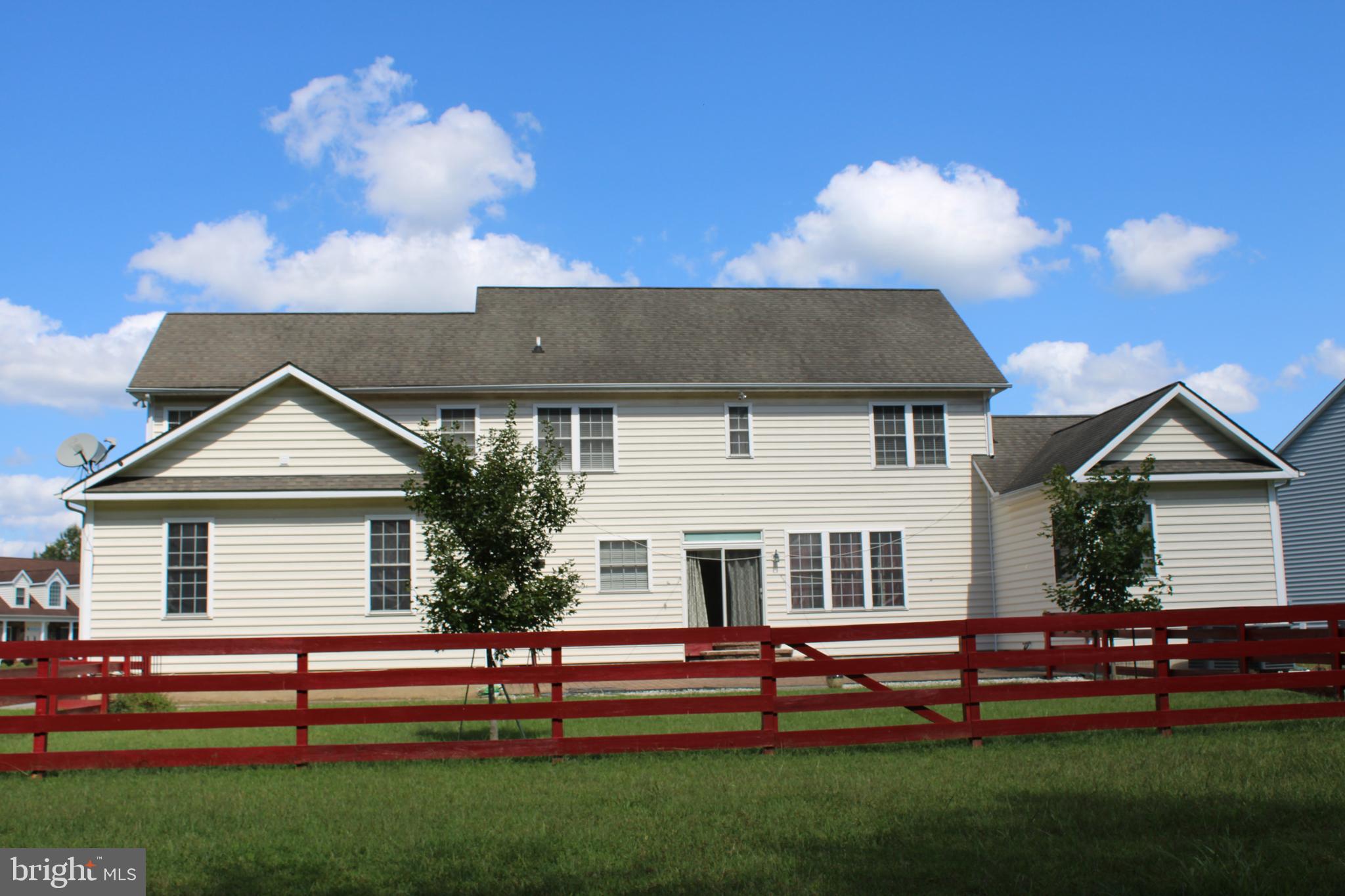 113 Paulowina Road Queen Anne, MD 21657 - Photo 41 of 42 a front view of a house with a garden and plants